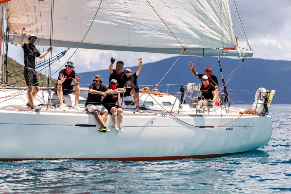 First 47.7 Kali - crew waving calm waters